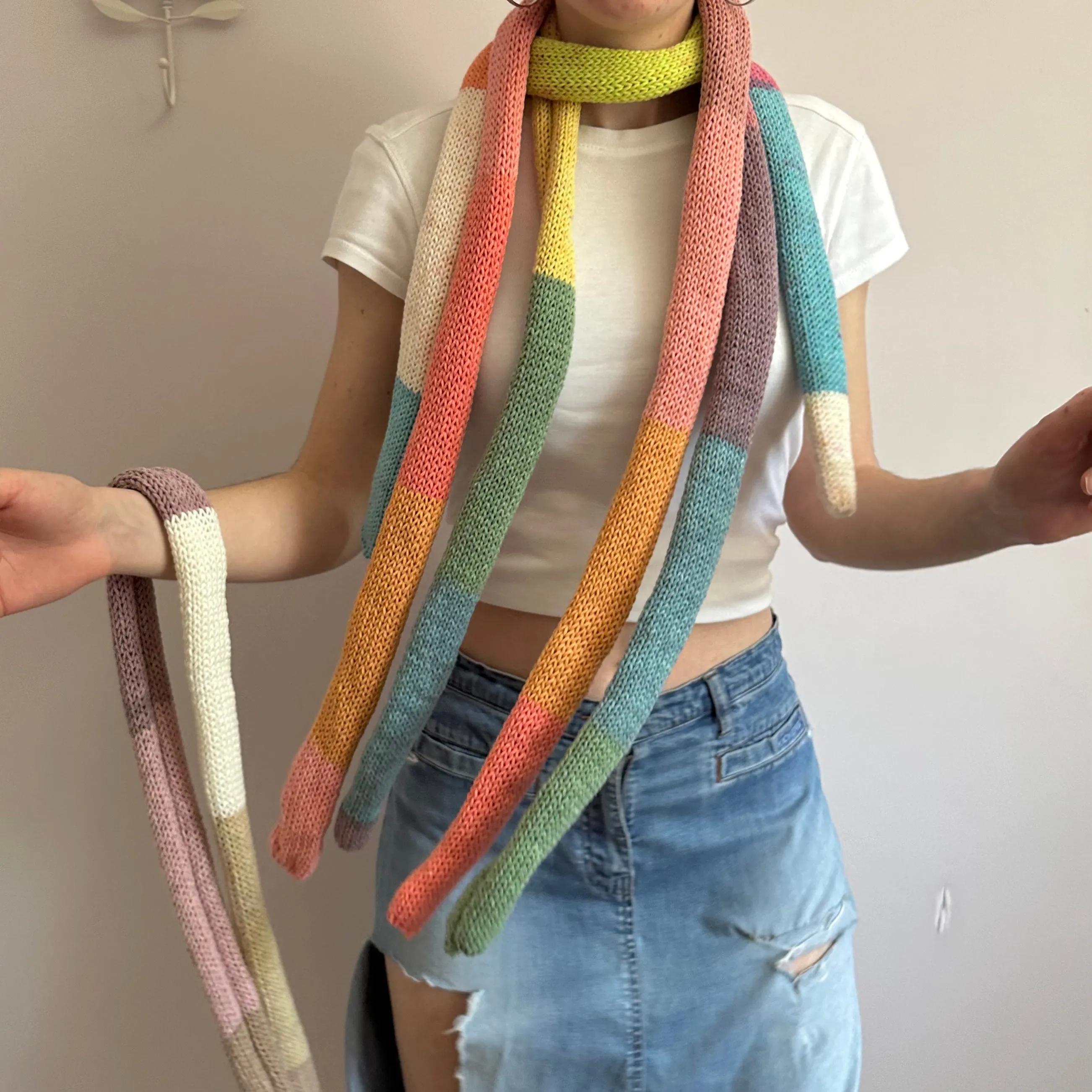 Handmade knitted colour block skinny scarf in coral and orange